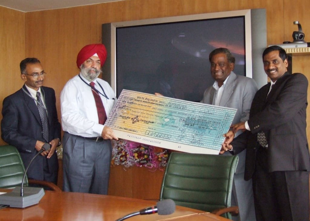 Dr Jivtesh Singh Maini, (second from left) Chairman, NHAI receiving a Cheque from Sh. G. Subba Rao, Dir GMR Group…