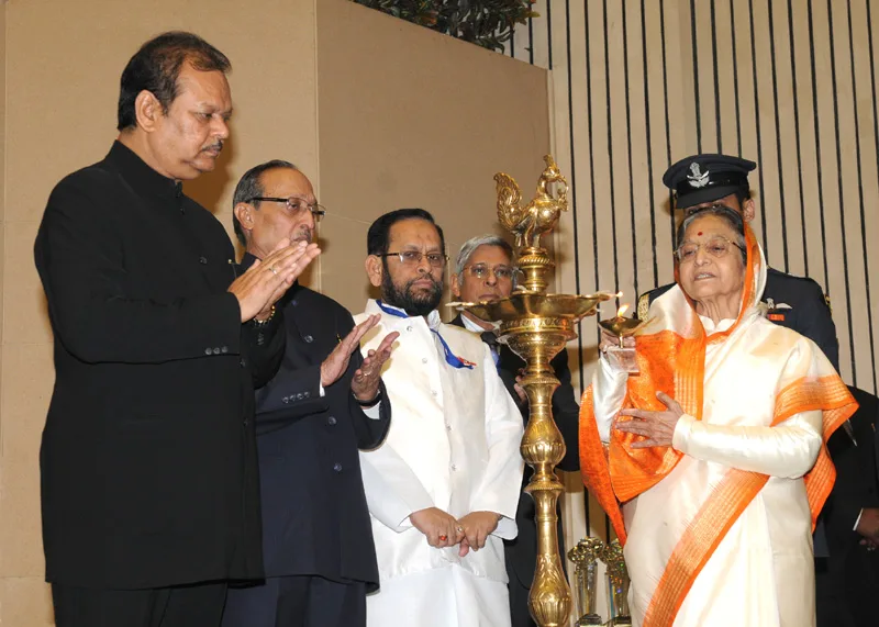 The President, Smt. Pratibha Devisingh Patil lighting the lamp at the National Tourism Awards..