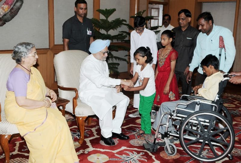 Children tying ‘Rakhi’ to the Prime Minister, Dr. Manmohan Singh, on the occasion of…