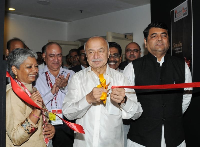The Union Home Minister, Shri Sushilkumar Shinde inaugurating an exhibition, during the...