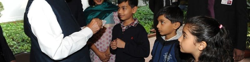 The children greeting the Prime Minister, Dr. Manmohan Singh and getting his autograph, ...