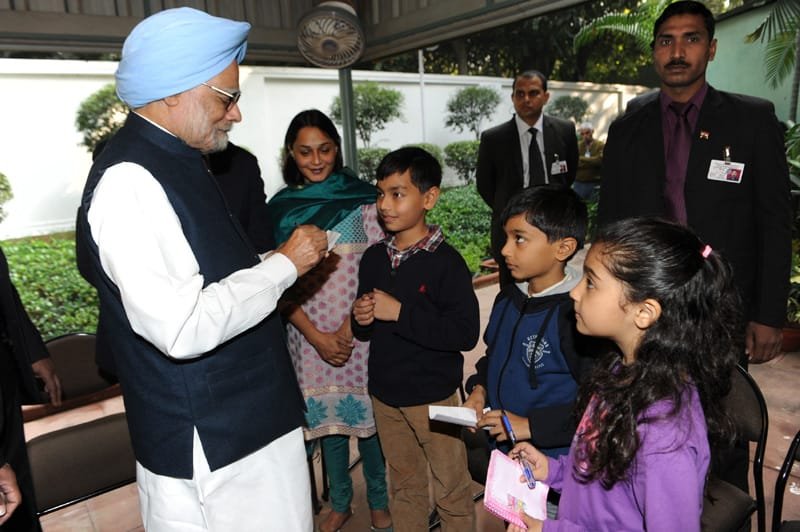 The children greeting the Prime Minister, Dr. Manmohan Singh and getting his autograph, …