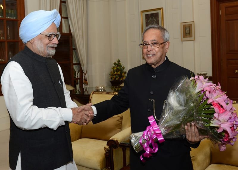 The Prime Minister, Dr. Manmohan Singh greeting the President,…