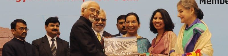 The Vice President, Shri Mohd. Hamid Ansari releasing a coffee table book of...