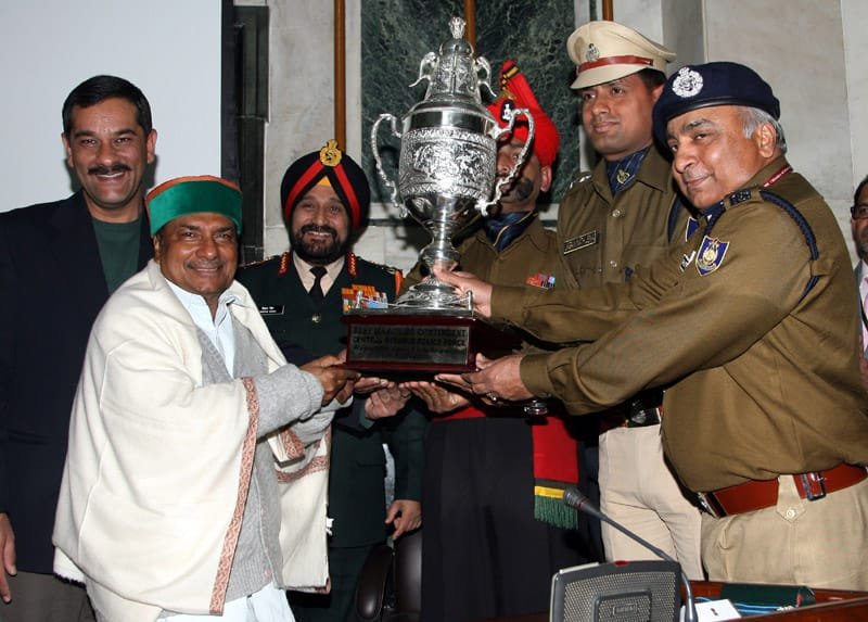 The Defence Minister, Shri A. K. Antony presenting trophy to CRPF…