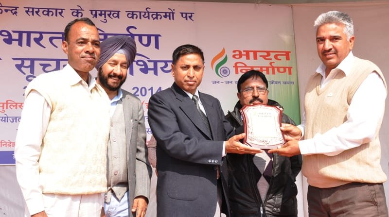 The ADC, Sirsa, Shri Shiv Prasad Sharma presenting award to Red Cross Society…