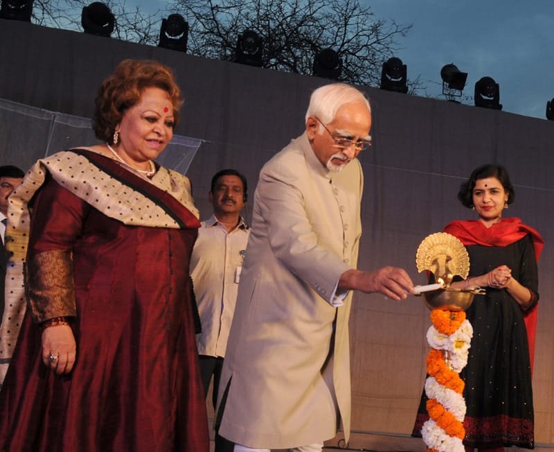 The Vice President, Shri Mohd. Hamid Ansari lighting the lamp to inaugurate…