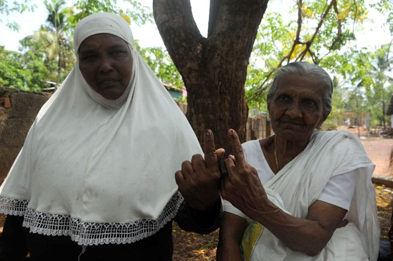 The old Woman voters showing mark of indelible ink after casting her vote,…