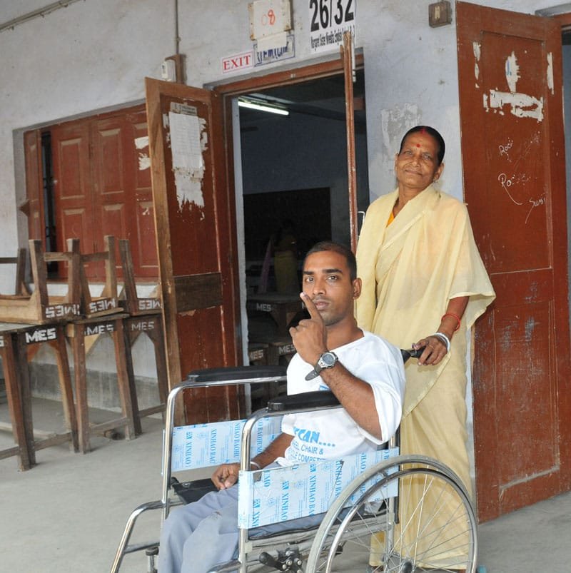 The physically handicapped voter showing mark of indelible ink after casting…