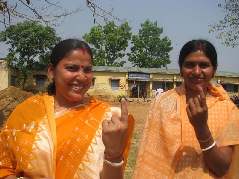 Two female voters showing mark of indelible ink after casting her vote,…