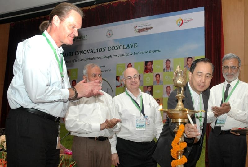The Director General, ICRISAT, Dr. William D. Dar lighting the lamp to …