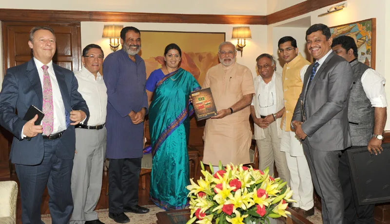 The Prime Minister, Shri Narendra Modi being presented the first copy of…