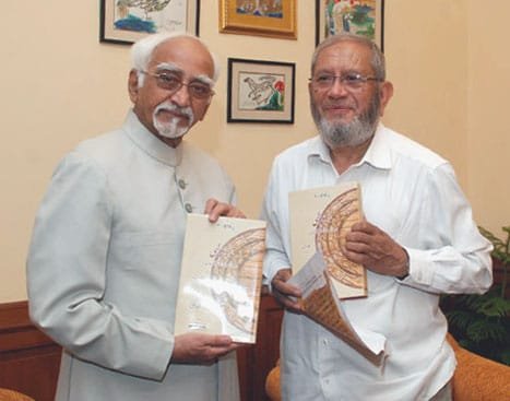 The Vice President, Shri Mohd. Hamid Ansari being presented a book entitled...