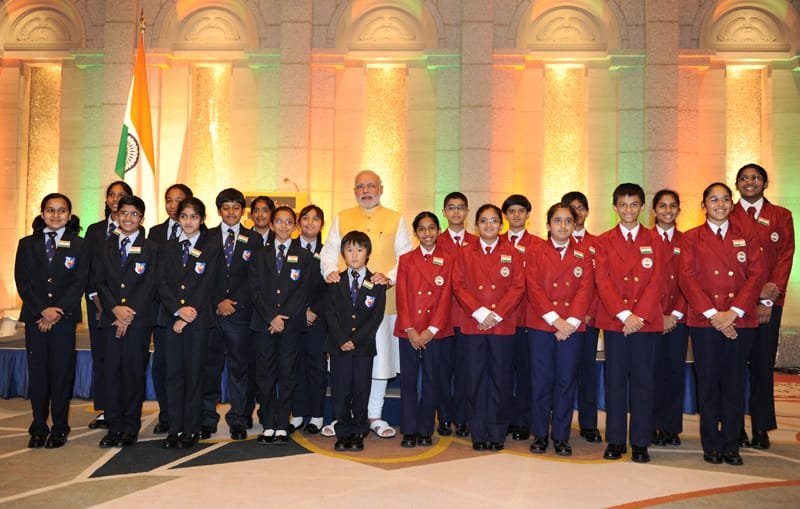 The Prime Minister, Shri Narendra Modi with the children during the Indian…
