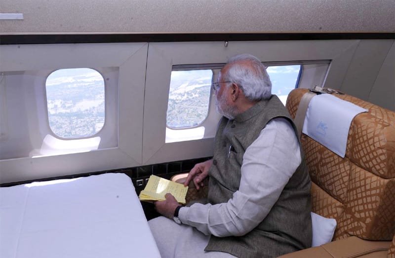 The Prime Minister, Shri Narendra Modi taking the aerial view of the situation of …