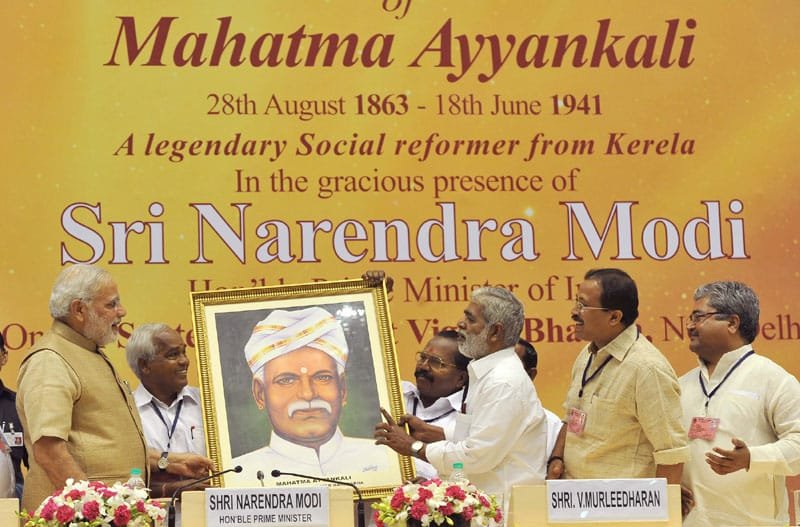 The Prime Minister, Shri Narendra Modi being presented a portrait of Mahatma…