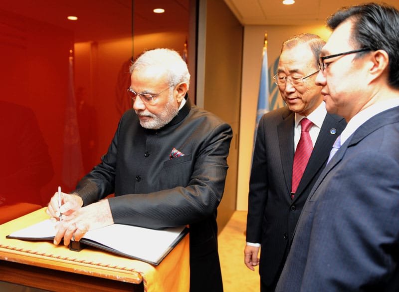 The Prime Minister, Shri Narendra Modi signing the visitor’s book at the…