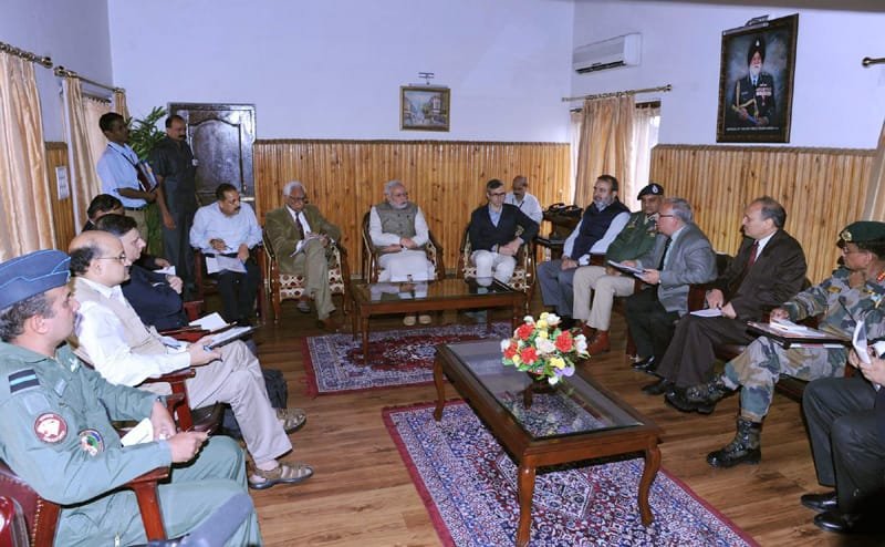 The Prime Minister, Shri Narendra Modi presiding the meeting at Srinagar to …