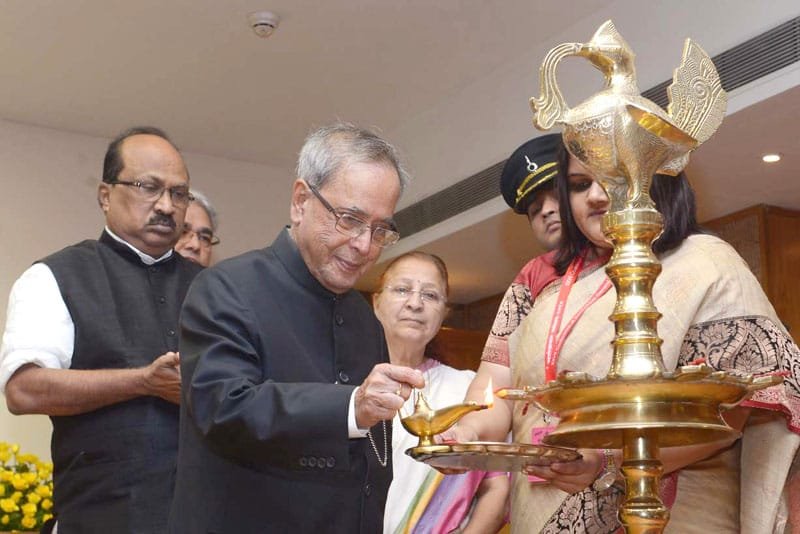 The President, Shri Pranab Mukherjee lighting the lamp to inaugurate the …
