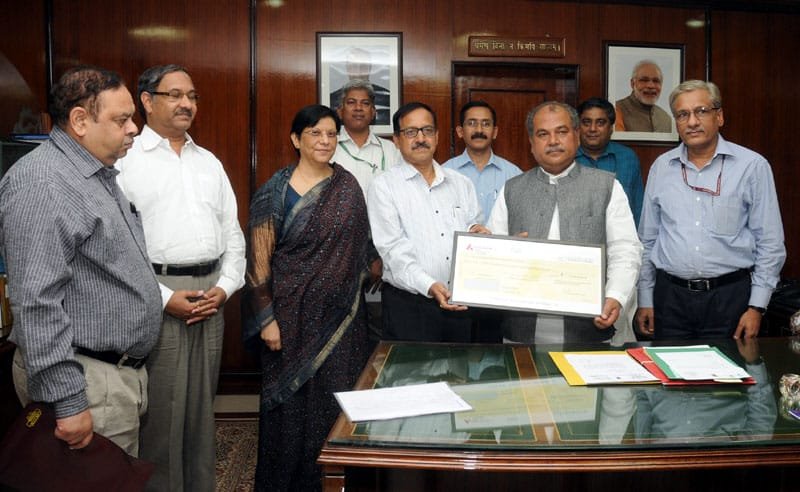 The CMD of MOIL, Shri G.P. Kundargi presenting a dividend cheque for the year …