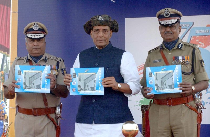 The Union Home Minister, Shri Rajnath Singh releasing a souvenir, at the CRPF …