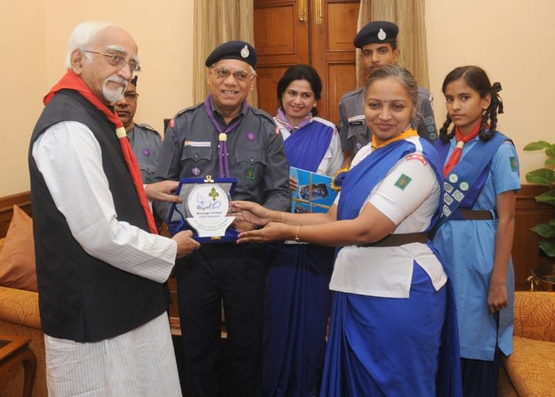 The Vice President, Shri Mohd. Hamid Ansari being presented a memento by the ..