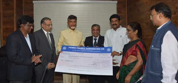 M K GOEL,CMD ,PFC HANDSOVER A CHEQUE OF Rs. 5.80Cr. TO CM ANDHRA PRADESH..