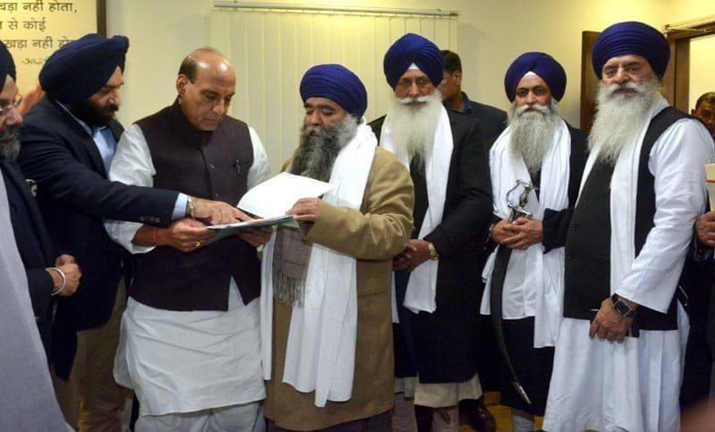 The Union Home Minister, Shri Rajnath Singh receiving a memorandum from a ...