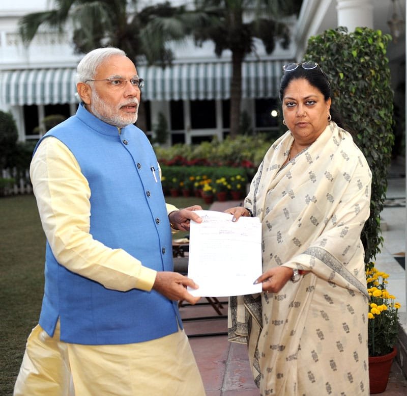 The Chief Minister of Rajasthan, Smt. Vasundhara Raje Scindia presenting a draft …