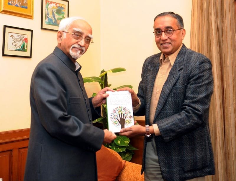 The Vice President, Shri Mohd. Hamid Ansari being presented a book entitled..