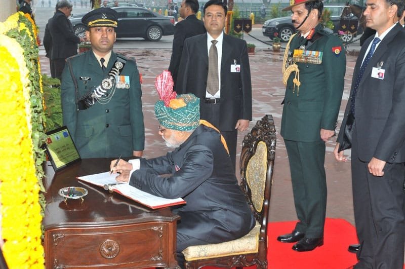 The Prime Minister, Shri Narendra Modi writing on the visitor’s book at …