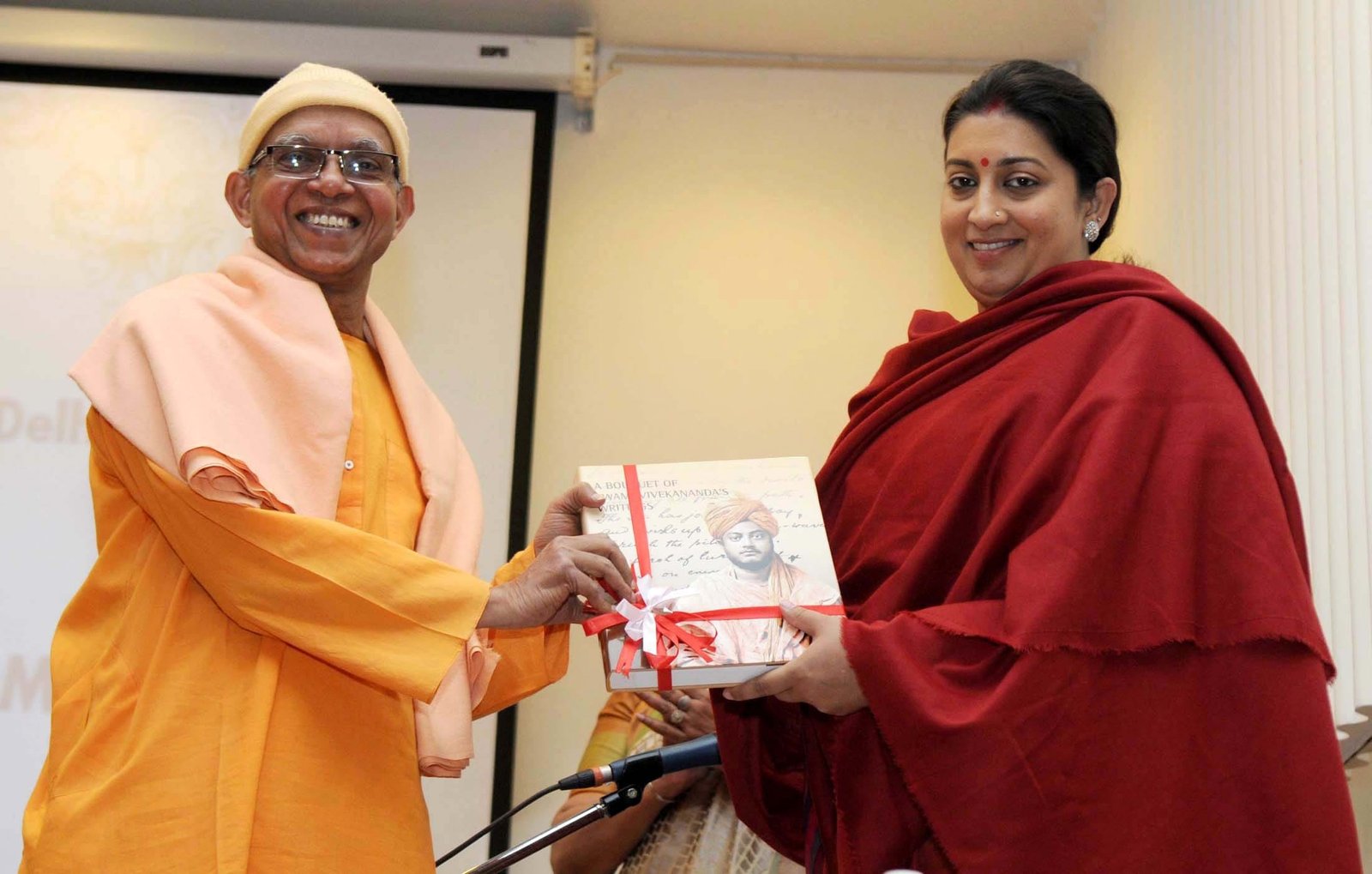 The Union Minister for Human Resource Development, Smt. Smriti Irani being presented a book by..