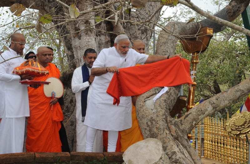 The Prime Minister, Shri Narendra Modi offer prayers, at the Sri Maha Bodhi Tree, in..