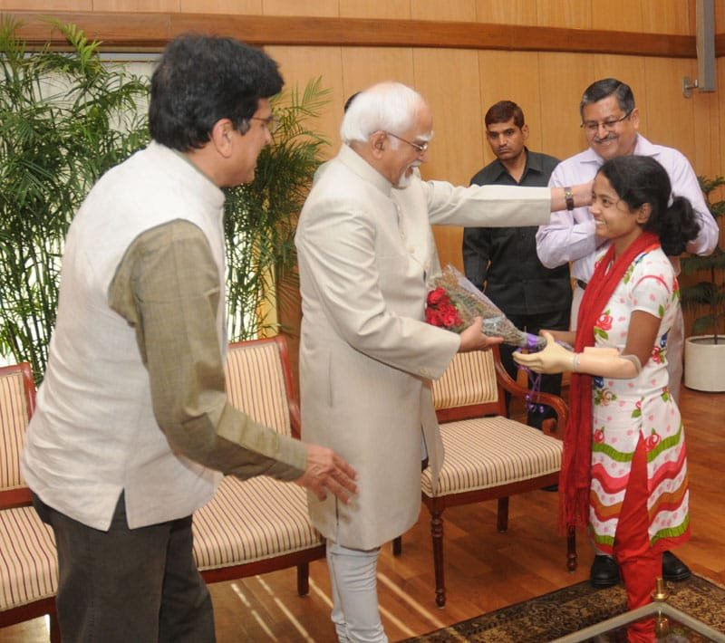 The Vice President, Shri Mohd. Hamid Ansari interacting a girl fitted ..