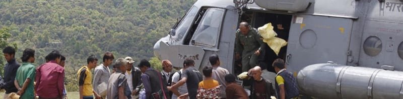 Stranded persons to be taken to a safer place, queuing up for boarding an Indian Air ..
