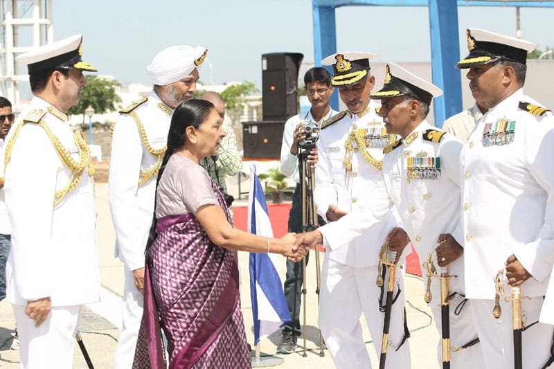 The Chief Minister of Gujarat, Smt. Anandiben Patel congratulating Commodore B.R. Prakash, during ..