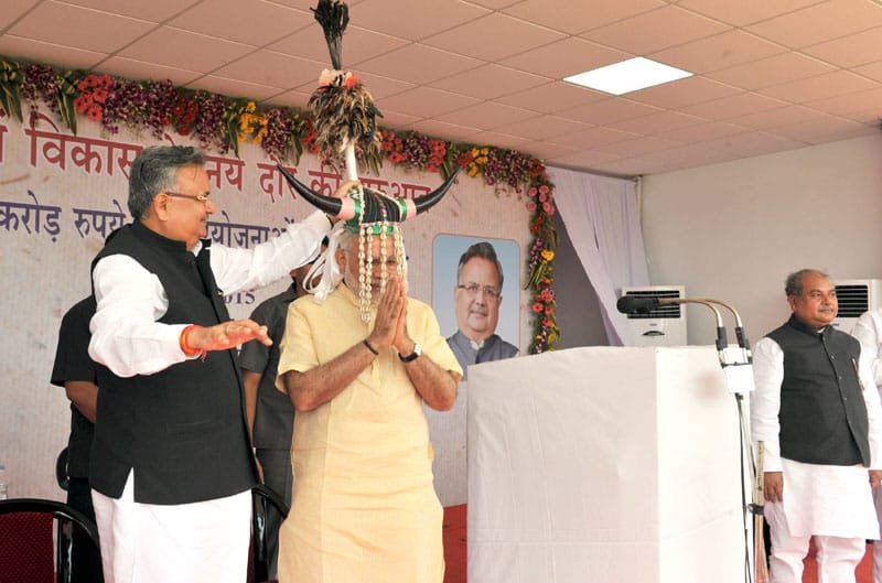 The Prime Minister, Shri Narendra Modi being presented a traditional Bison-Horn Headdress of ..