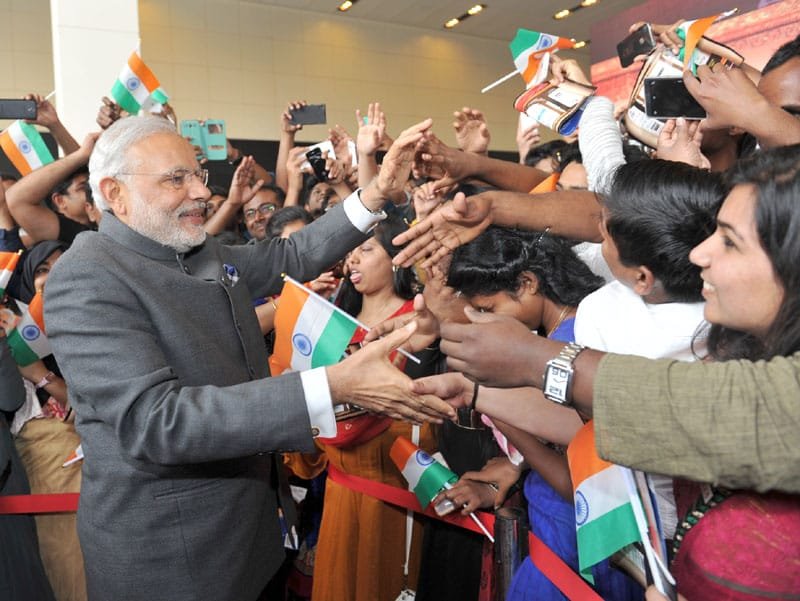 The Prime Minister, Shri Narendra Modi interacting with the people at the Indian ..