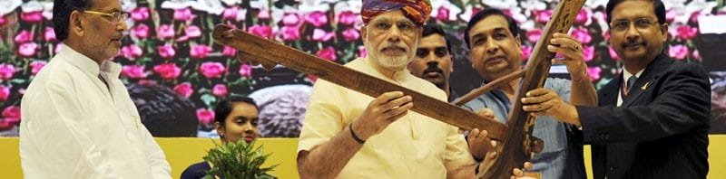 The Prime Minister, Shri Narendra Modi being presented a "Plough" as symbol of..