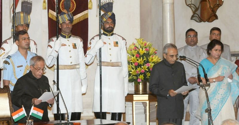 The President, Shri Pranab Mukherjee administering the oath of office to Shri Vijai Sharma as..