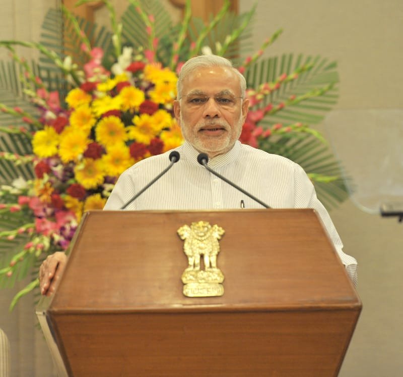 The Prime Minister, Shri Narendra Modi addressing at the release ceremony of..