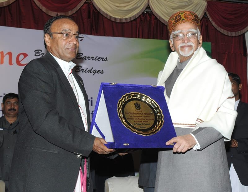 The Vice President, Shri Mohd. Hamid Ansari being presented a memento at the..