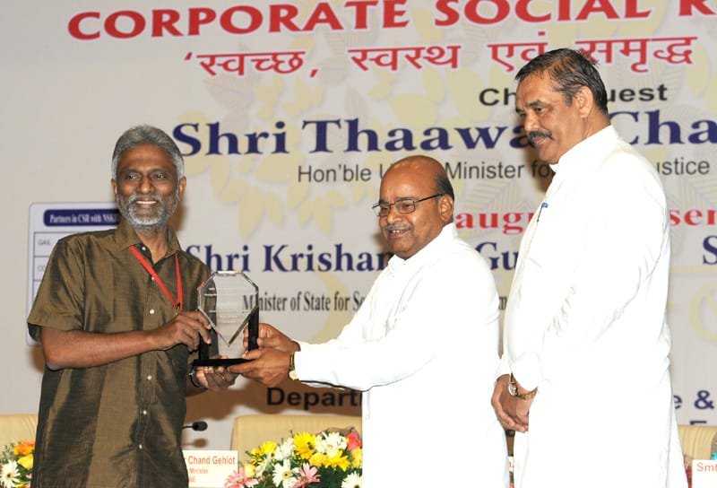 The Union Minister for Social Justice and Empowerment, Shri Thaawar Chand Gehlot felicitating..