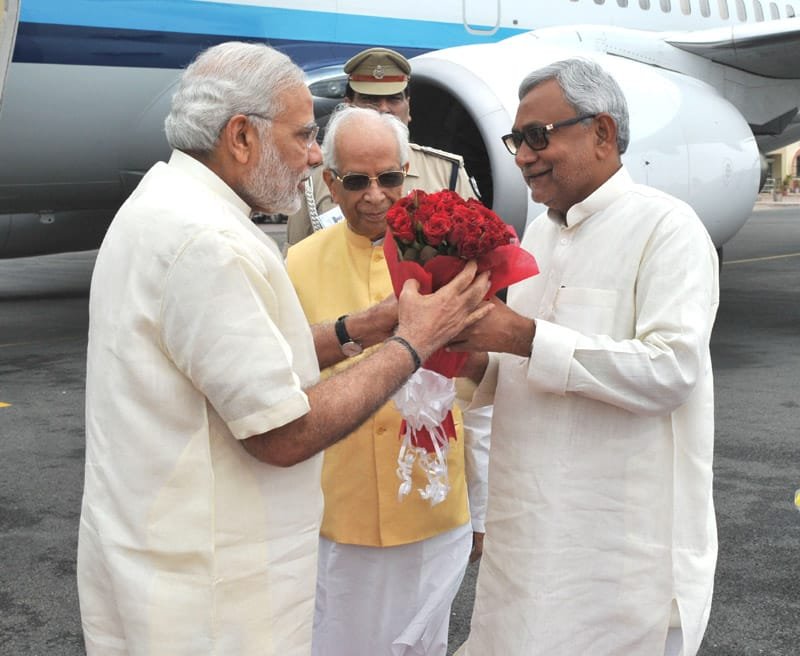 The Prime Minister, Shri Narendra Modi being welcomed by the Governor of Bihar, ..