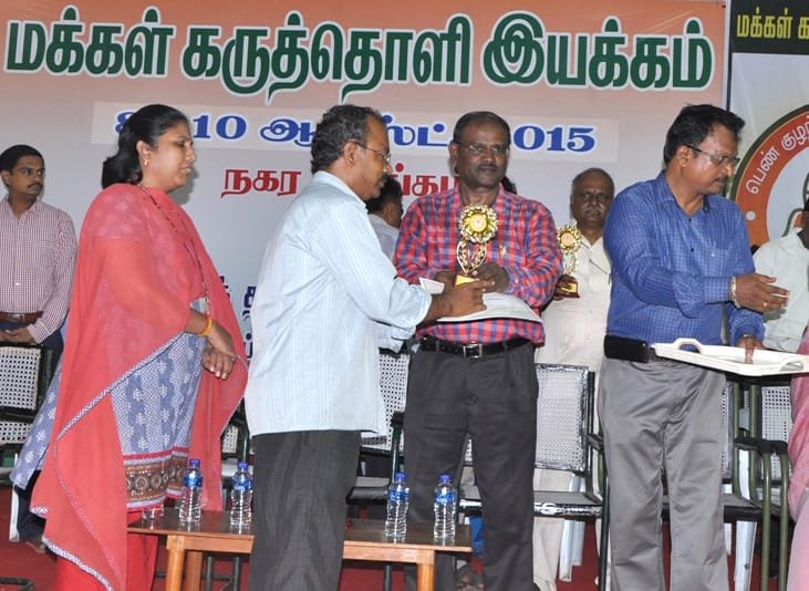 The Director (News), Doordarshan, Chennai, Shri E. Mariappan giving away certificates and..