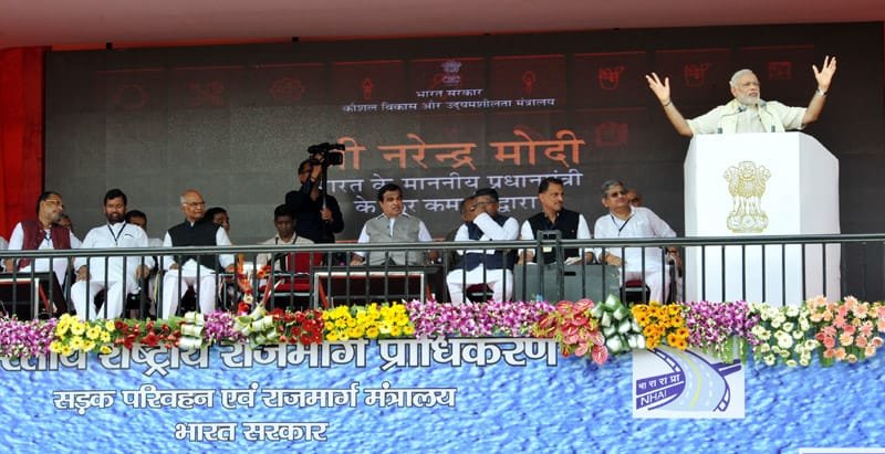 The Prime Minister, Shri Narendra Modi addressing at the dedication of the National Highway ..
