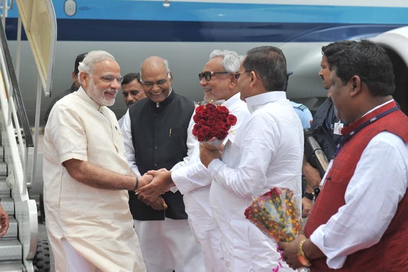 The Prime Minister, Shri Narendra Modi being received by the Governor of Bihar,..