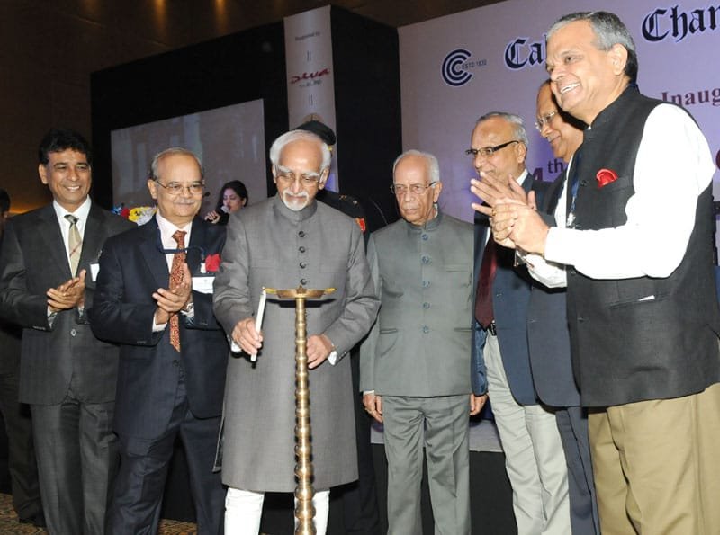 The Vice President, Shri Mohd. Hamid Ansari lighting the lamp to inaugurate the ..