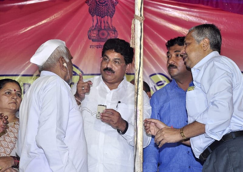 Shri A.T. (Nana) Patil, Member of Parliament Jalgaon, presenting hearing aids to..