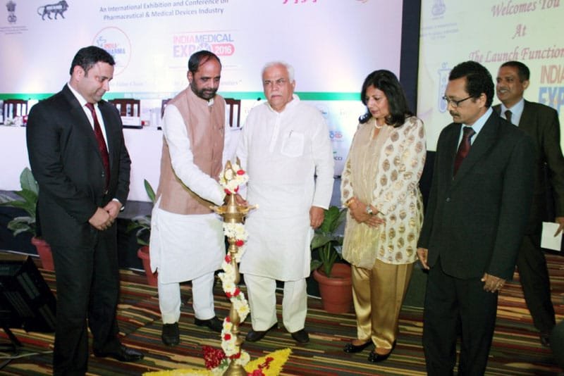 The Minister of State for Chemicals & Fertilizers, Shri Hansraj Gangaram Ahir lighting the lamp to..